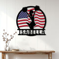 Cheerleader silhouette metal wall sign displayed on a bright paneled entryway wall