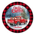 Round Christmas metal sign featuring a vintage red pickup truck, gifts, snowy trees, and buffalo plaid border