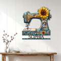 Floral sewing room wall decor featuring a colorful sewing machine sign above a console table