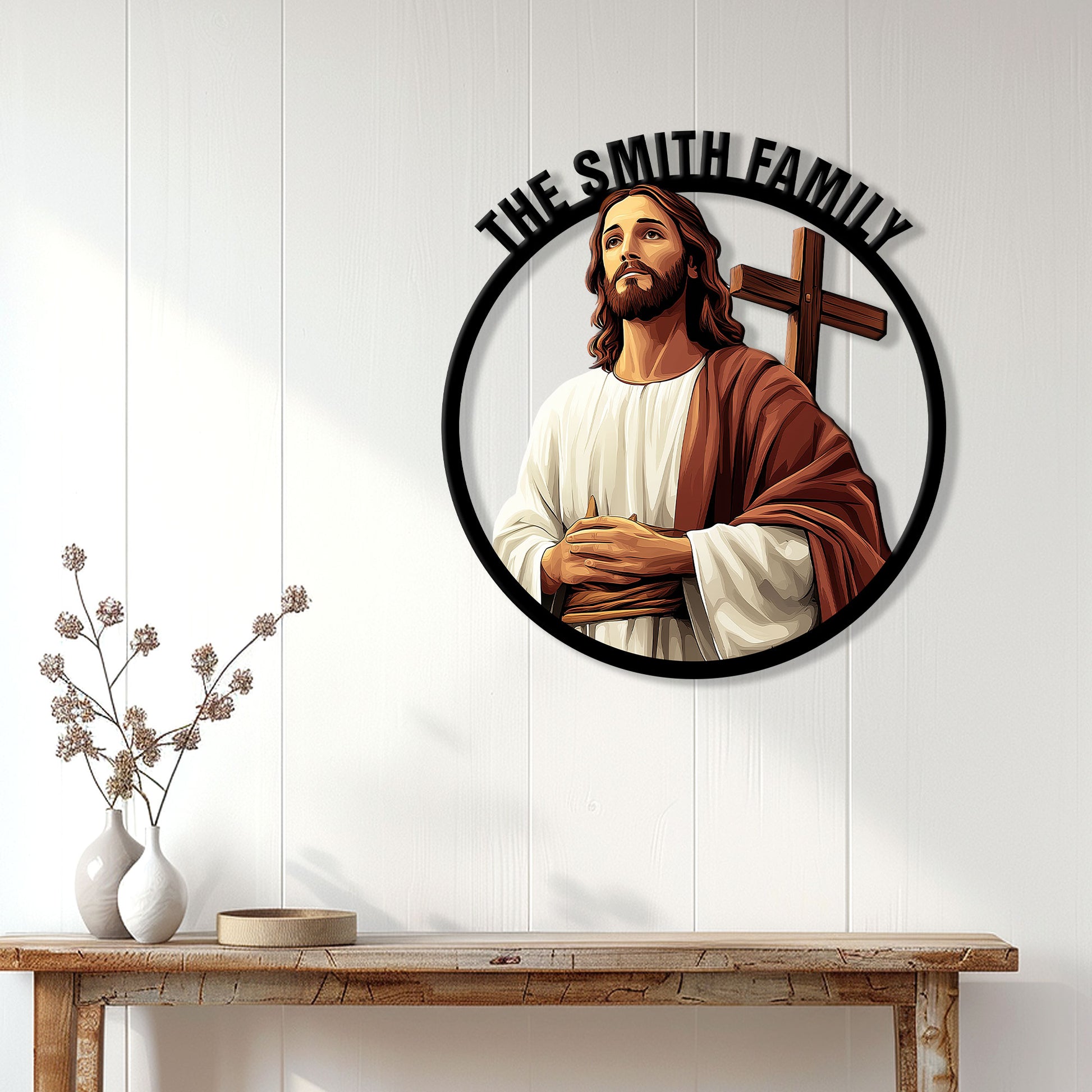 Jesus and cross metal sign displayed on a bright paneled wall above a console table