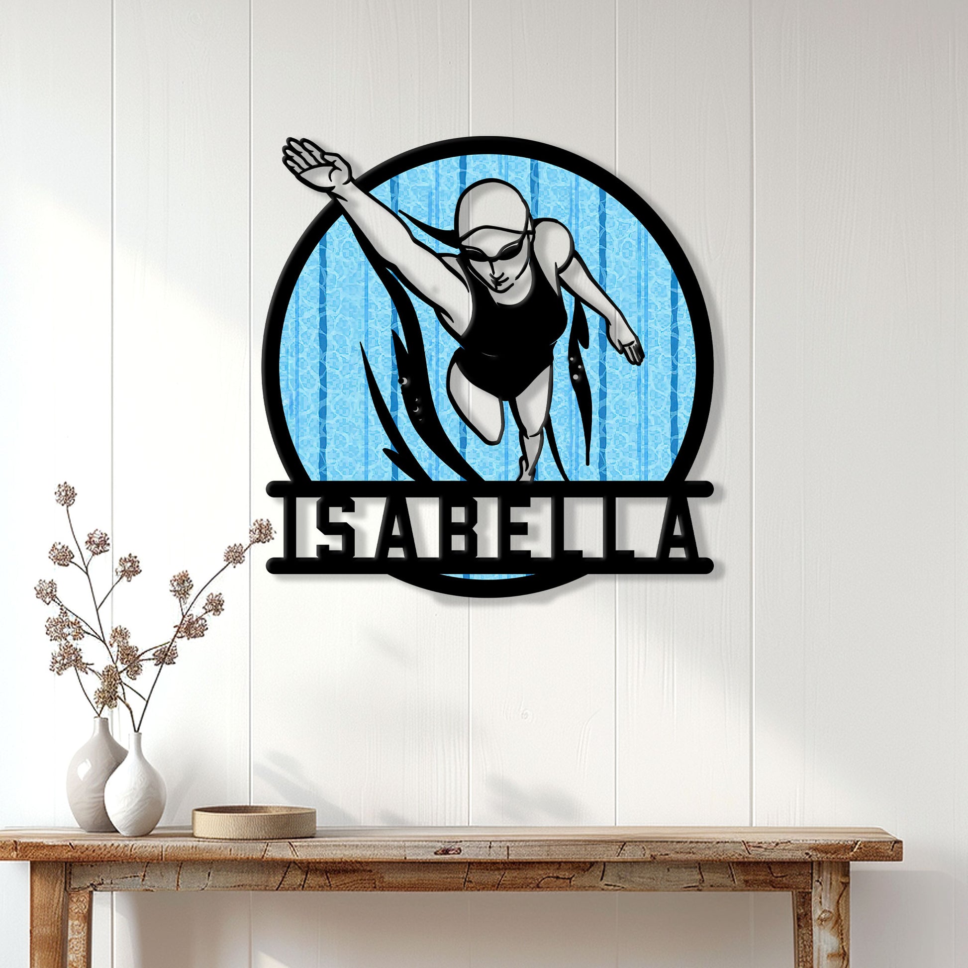 Swimmer wall sign displayed above a console table in a bright modern home