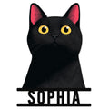 Close-up black cat metal sign with bright yellow eyes, pink ears, and a bold silhouette design