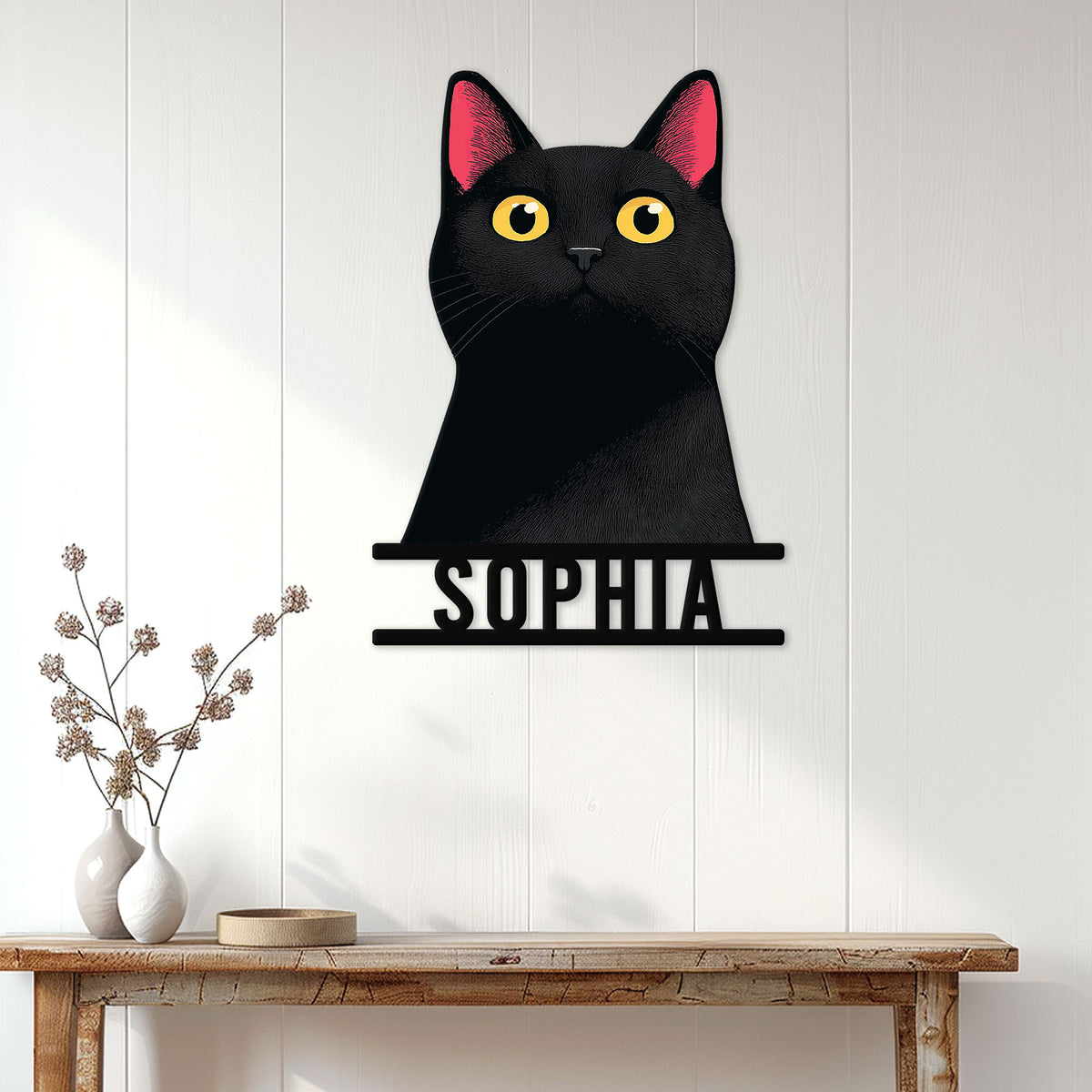 Black cat metal sign displayed as stylish wall decor above a console table in a bright home