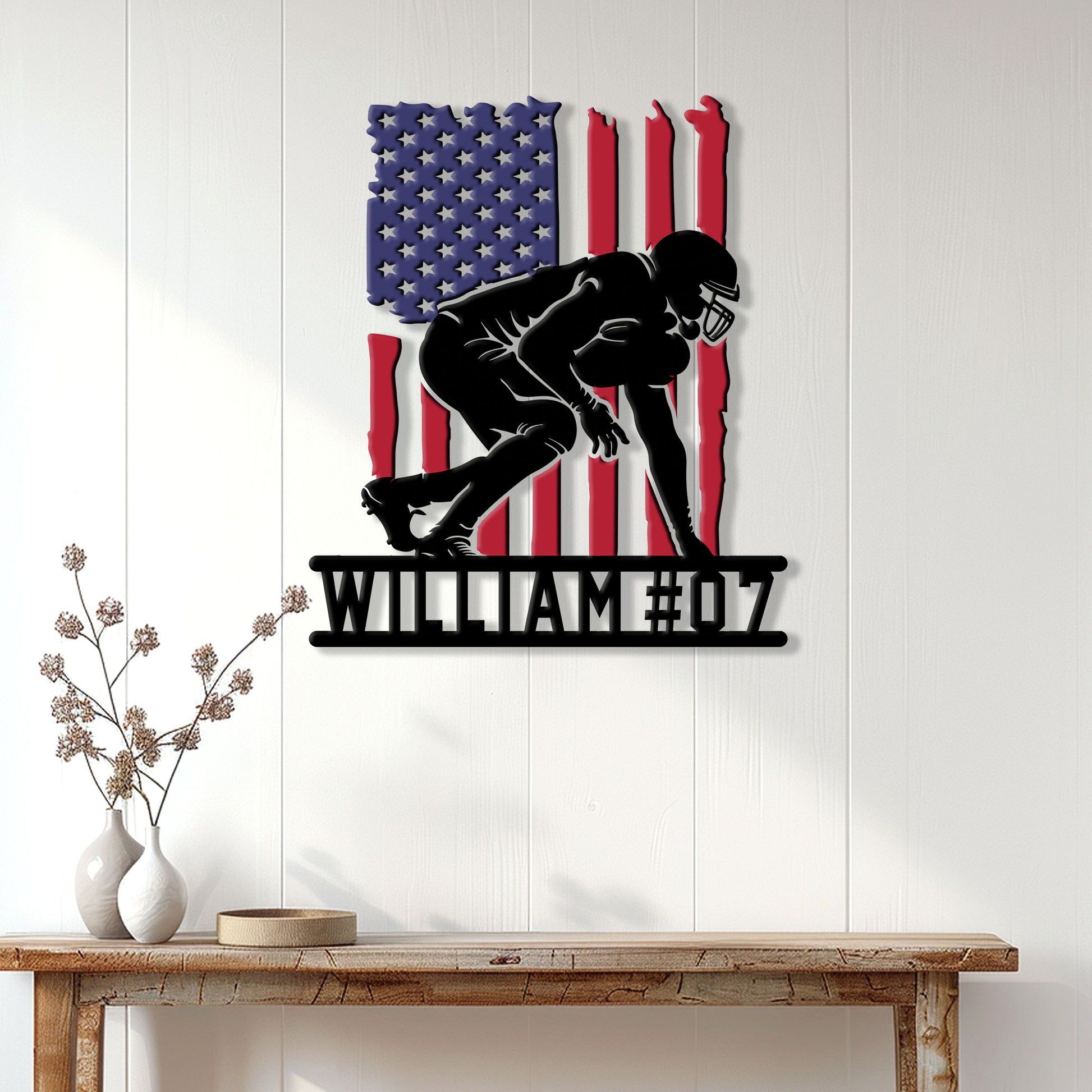 American flag football metal sign displayed as wall decor above a console table