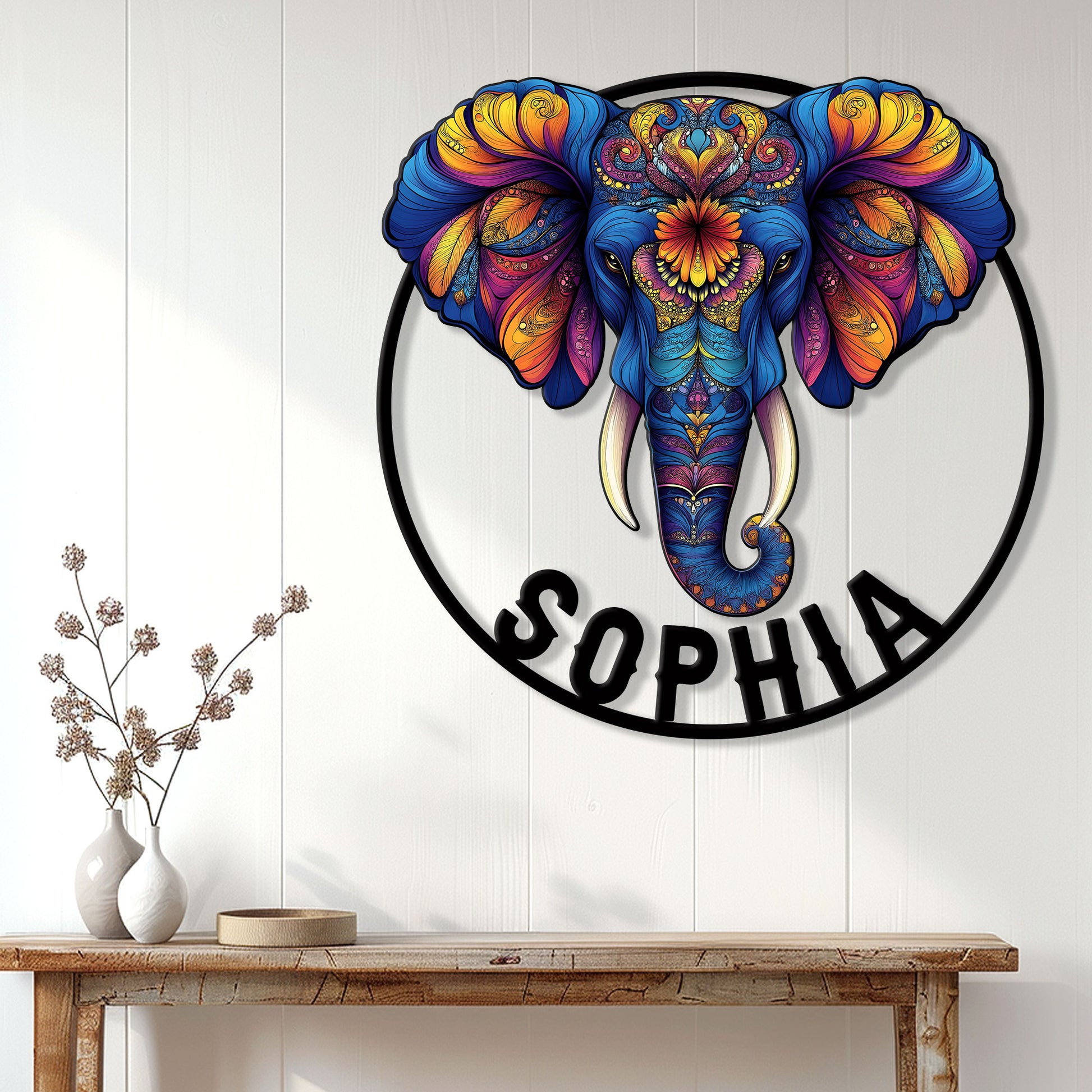Colorful elephant wall sign displayed above a console table in a bright modern home interior