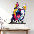 Colorful Husky portrait metal wall sign displayed on a bright white paneled wall above a console table