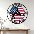 Wrestling wall decor displayed on a white paneled wall above a rustic console table