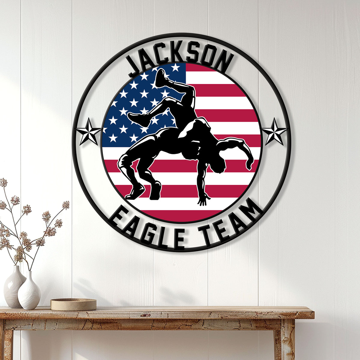 Wrestling wall decor displayed on a white paneled wall above a rustic console table