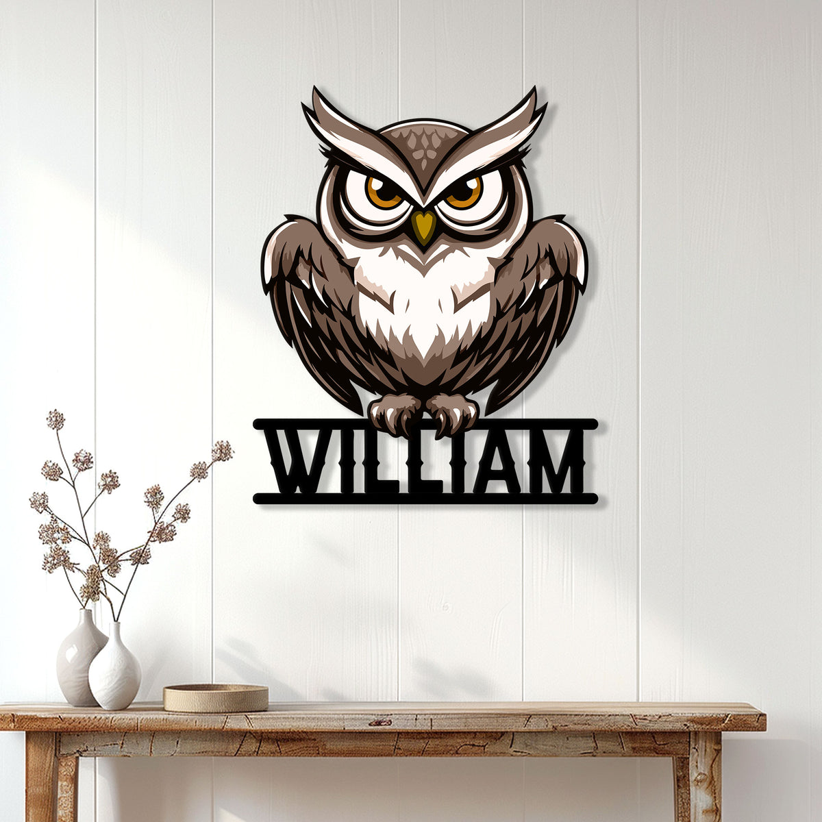 Brown owl metal wall sign styled above a console table in a bright home interior