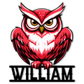 Close-up of a vivid red owl cut metal sign with bold eyes and feather details