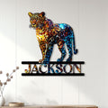 Colorful leopard wall sign displayed on white paneling above a console in a modern home