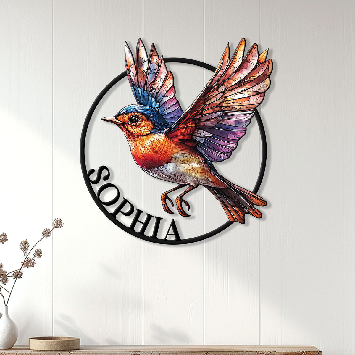 Colorful robin wall sign displayed on white paneling above a console for nature-inspired home decor