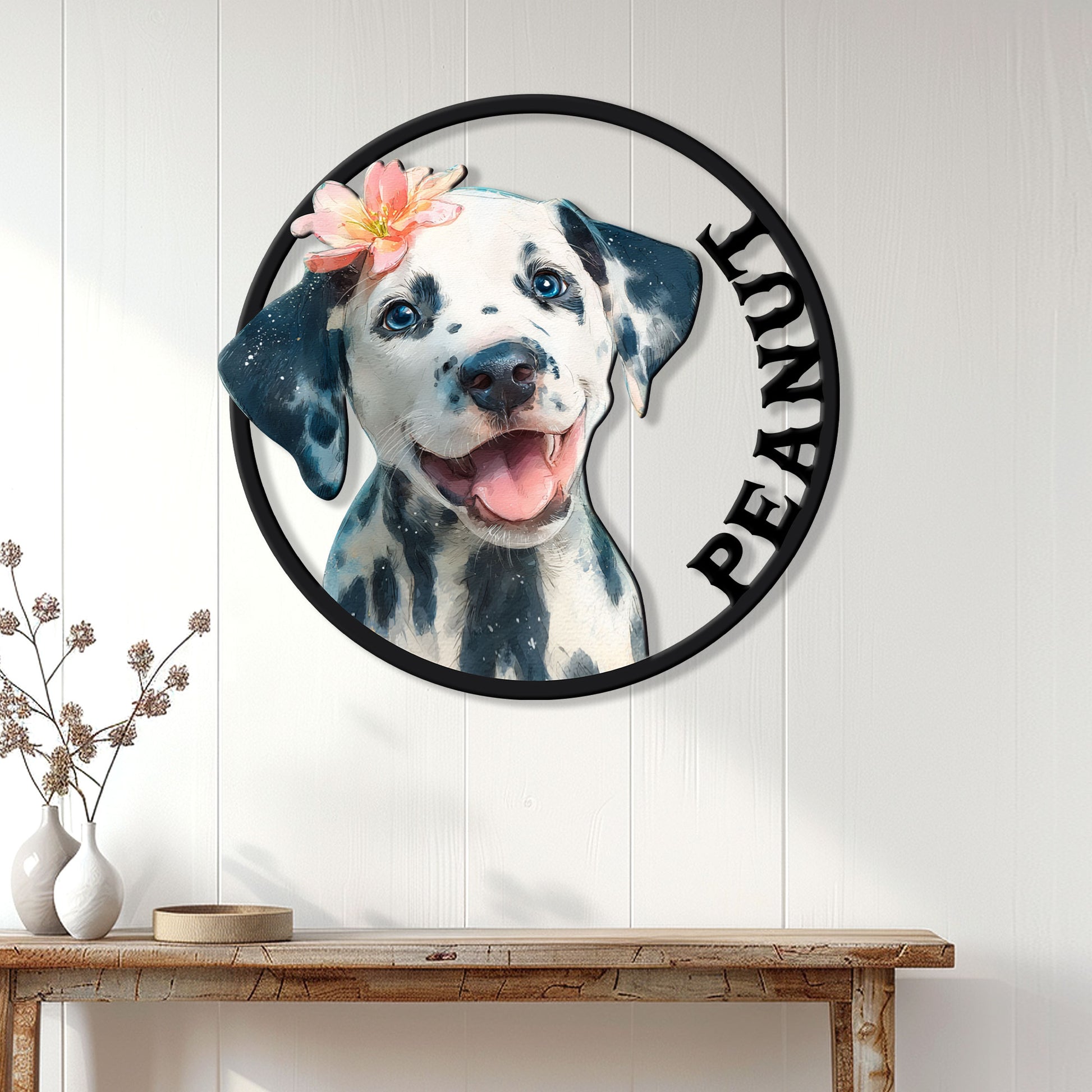 Dalmatian dog metal sign displayed on a white paneled wall above a rustic console table