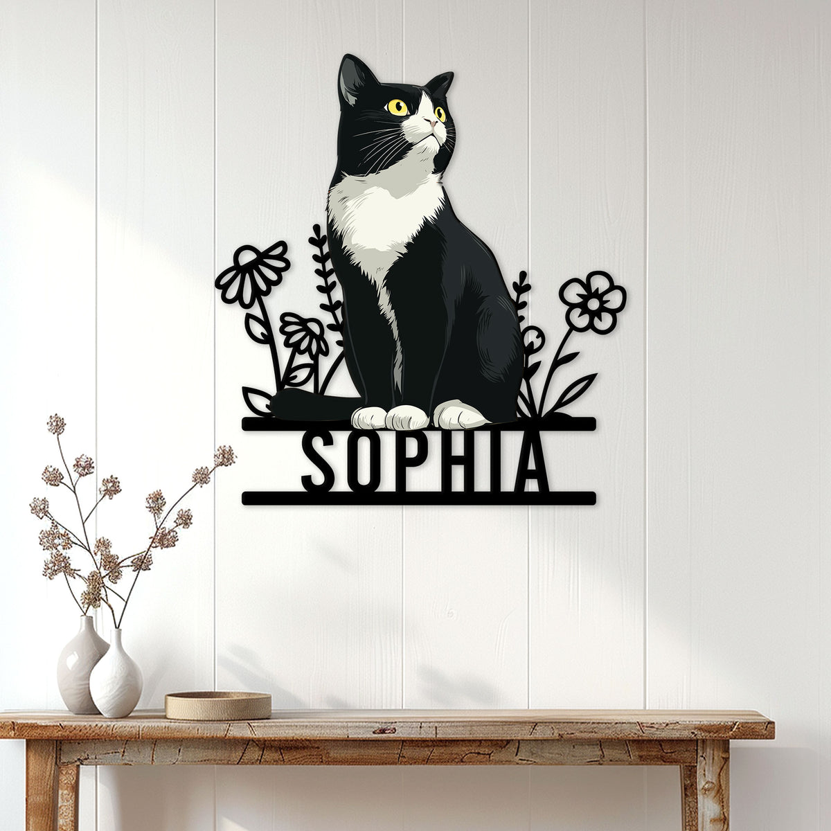 Tuxedo cat wall sign displayed above a console table in a bright home entryway