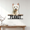 Westie metal wall sign displayed on a white paneled wall above a console table in a bright home