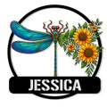 Colorful dragonfly metal sign with blue wings, sunflowers, green leaves, and a round black frame