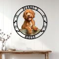 Labradoodle metal wall sign displayed on a white paneled entryway above a wooden console