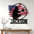 Patriotic baseball wall sign displayed on a light wood-paneled wall above a console table