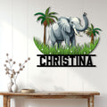 Tropical elephant metal wall sign displayed above a console table in a bright home interior