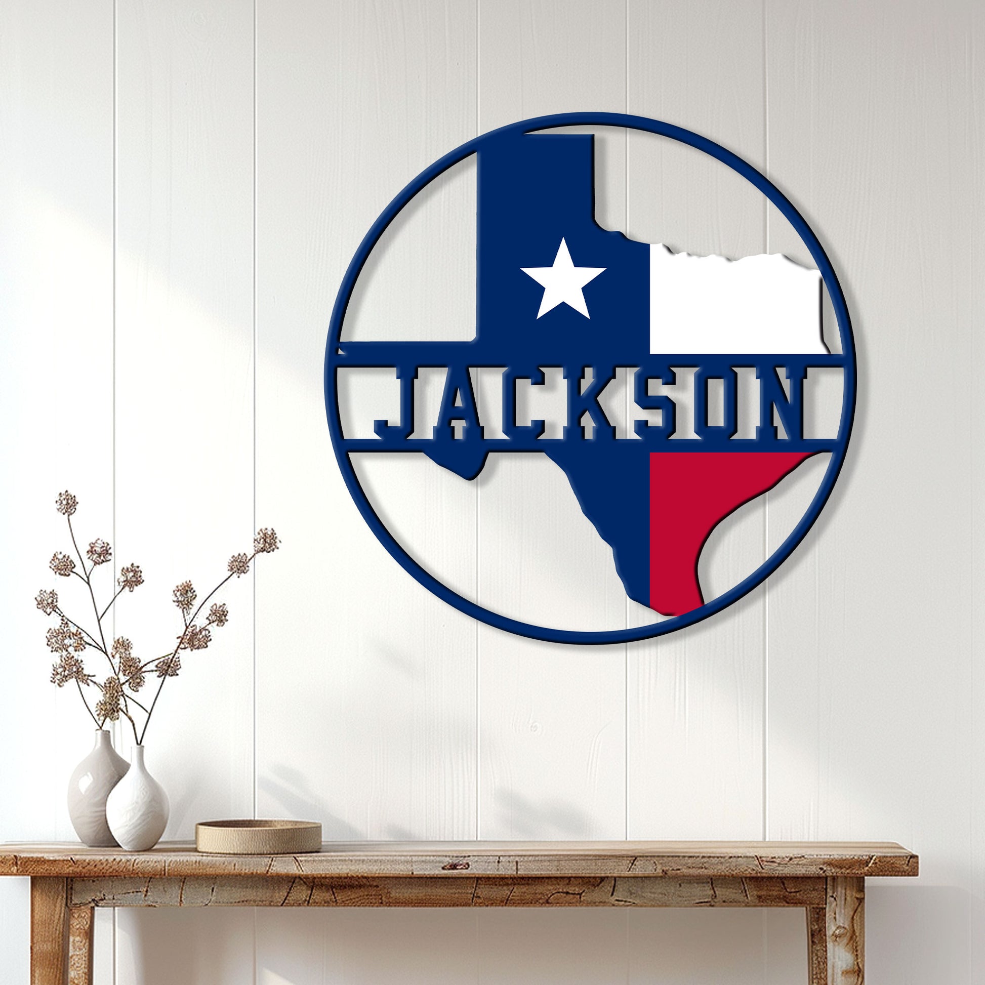 Texas metal wall decor displayed on a white paneled wall above a rustic console table