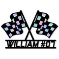 Close-up view of a racing metal sign with crossed checkered flags and bold cutout details