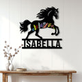 Floral horse silhouette metal sign displayed on a bright paneled wall above a console table