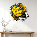 Softball wall decor displayed on a light paneled wall above a wood console table