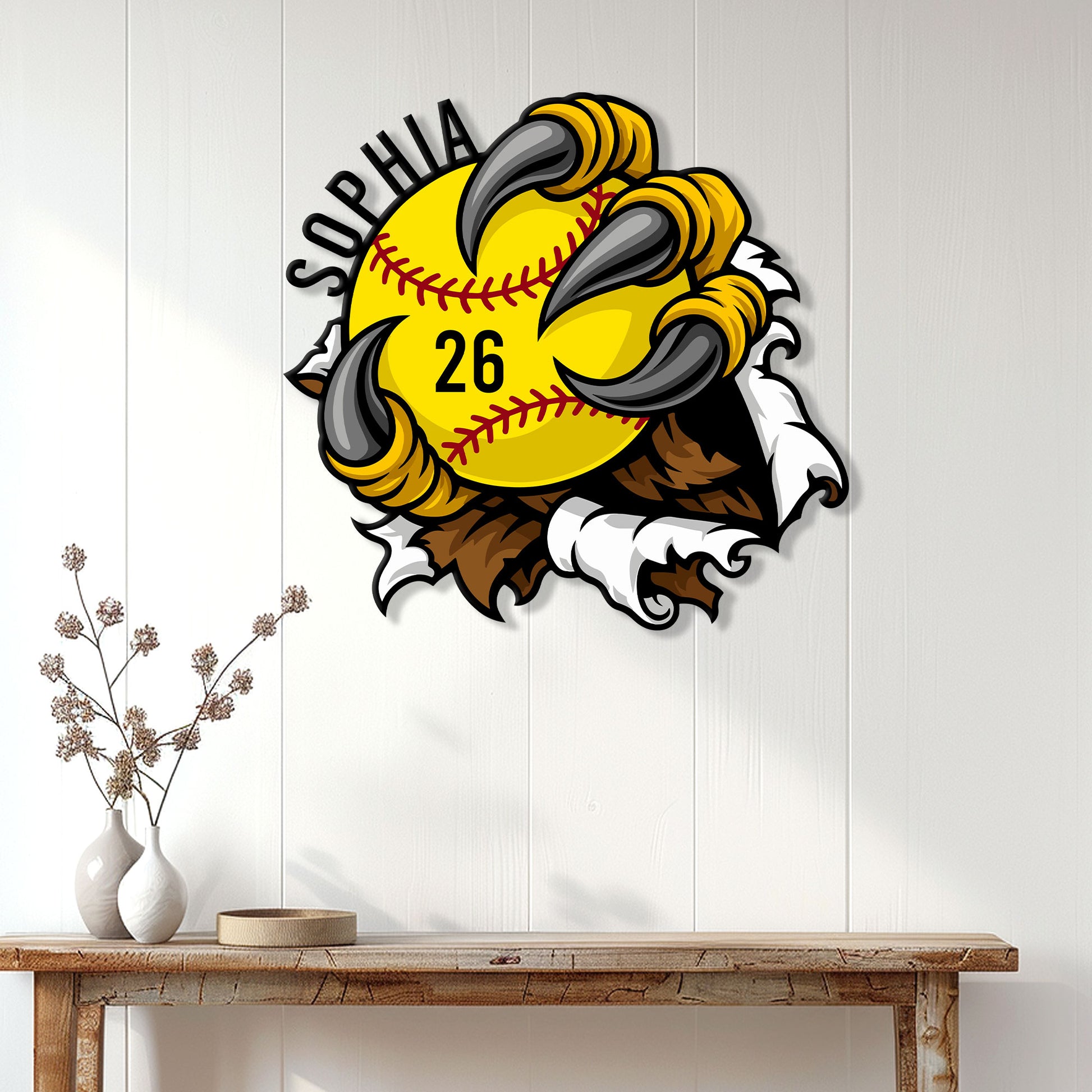 Softball wall decor displayed on a light paneled wall above a wood console table