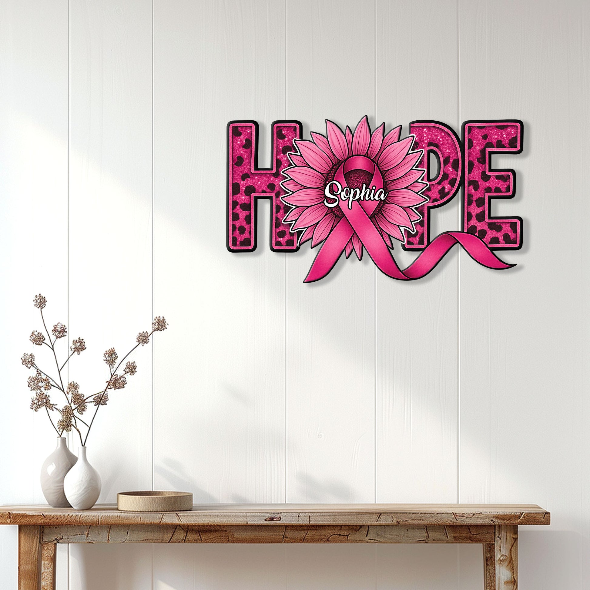 Breast cancer hope sign displayed on a white paneled wall above a console table