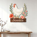 Custom chicken metal sign displayed on a white plank wall above a rustic console table