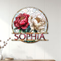 Floral wall decor displayed on a light paneled wall above a console for an elegant home accent