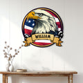 Patriotic eagle wall sign displayed on a white paneled wall above a wood console table