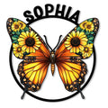 Colorful butterfly metal sign with orange wings, sunflower details, and a circular black frame