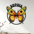 Sunflower butterfly wall decor displayed on a light wood-paneled wall in a bright home