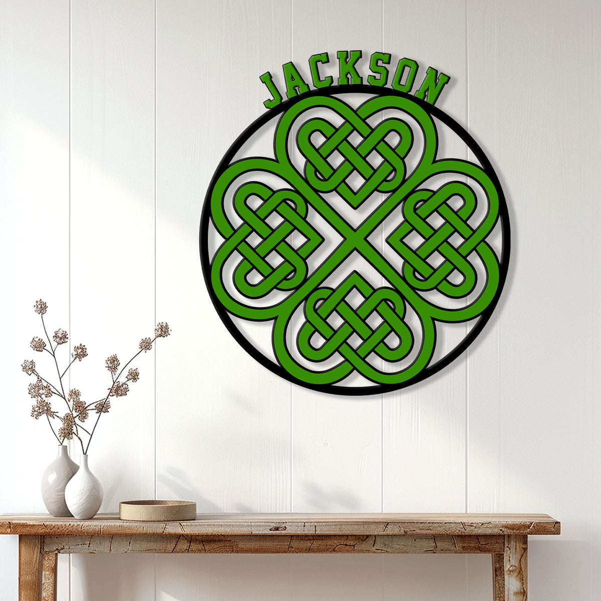 Irish Celtic knotwork shamrock metal sign displayed on a white paneled wall above a console table