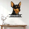Miniature Pinscher metal wall sign displayed above a console table in a bright home entryway
