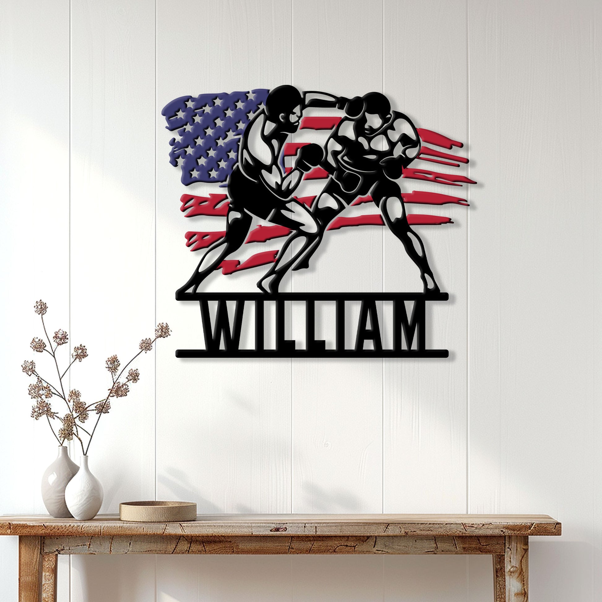 Boxing metal wall decor displayed above a console table in a bright home interior