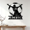 Soccer wall decor displayed on a light paneled wall above a console table