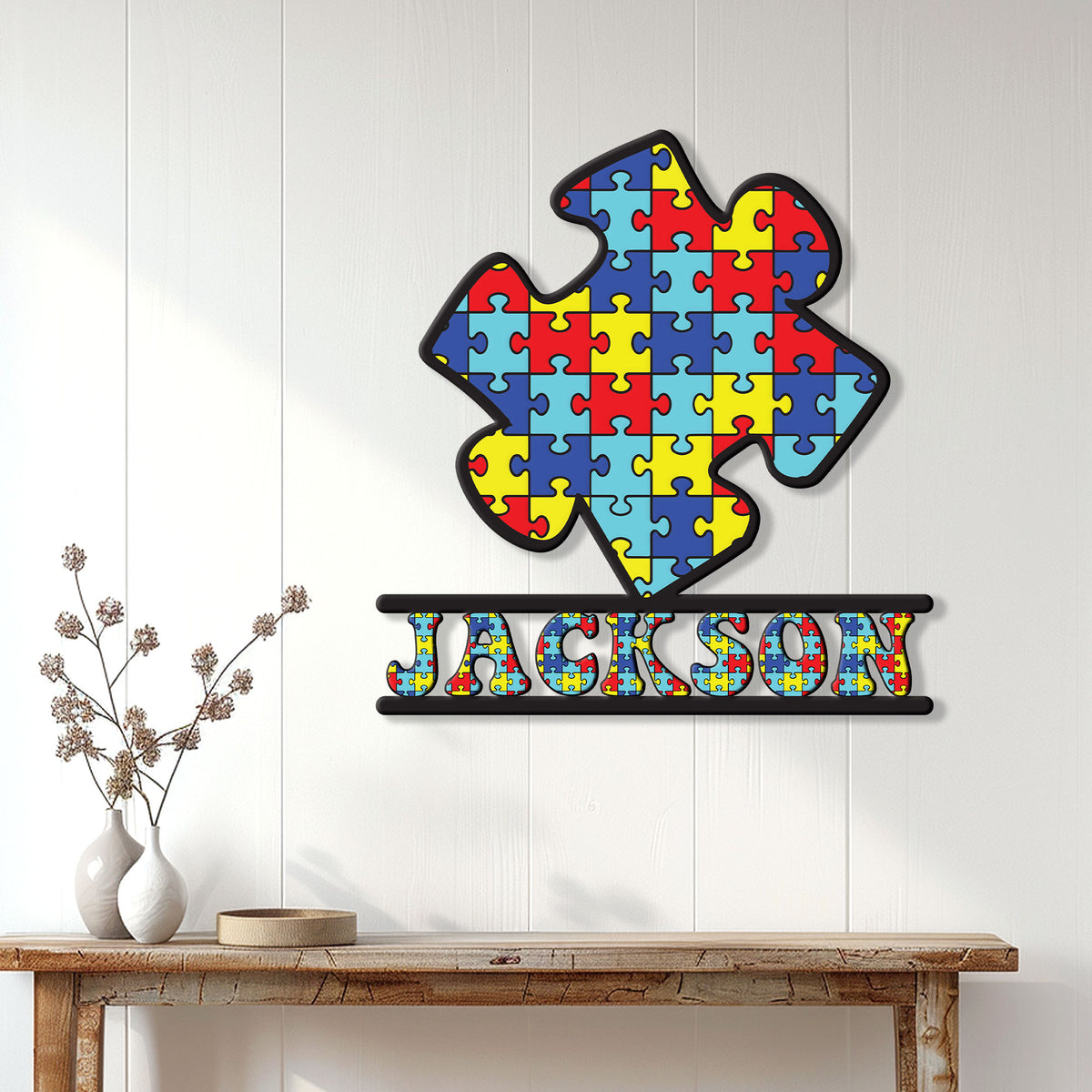 Colorful autism awareness metal sign displayed as bright wall decor in a home entryway