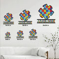 Autism awareness puzzle piece metal sign shown in multiple size options on a living room wall