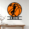 Basketball wall decor displayed on a white paneled wall above a console table