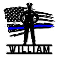 Police officer silhouette standing before a distressed American flag with a blue line on a metal sign