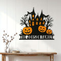Halloween haunted house metal sign displayed as seasonal wall decor above a wood console table