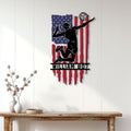 Patriotic volleyball wall decor displayed on a white paneled wall above a wood console table