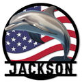 Dolphin metal sign with a leaping dolphin over a flowing American flag design