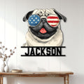 Patriotic pug wall sign displayed as dog lover decor on a bright wood-paneled wall