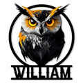 Geometric black, white, and gold owl metal sign with bold eyes and a circular frame