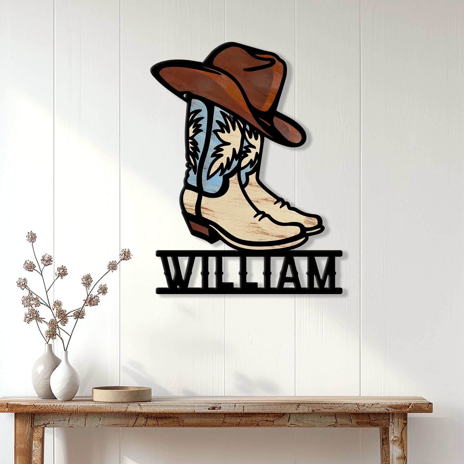 Cowboy boot and hat metal sign displayed on a light wood-paneled wall