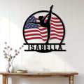 Patriotic gymnast wall sign displayed on a white paneled wall above a wooden console table