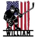 Patriotic hockey player metal sign featuring an American flag backdrop and crossed hockey stick
